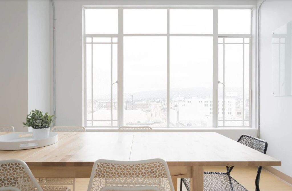 dining table in front of a large window