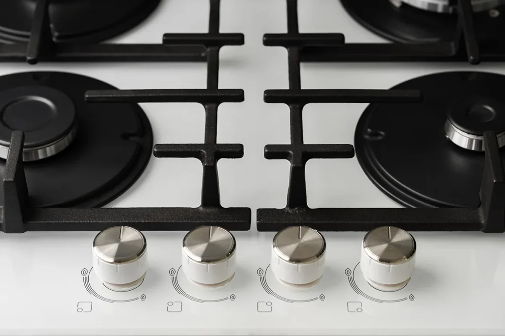 Knobs on an electric rangetop.