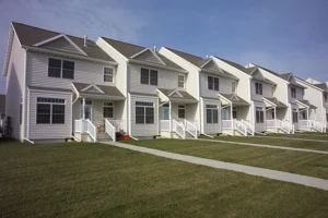 exterior of a row of white two-story attached homes - project