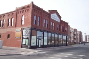 exterior of the corner of a two story brick building store front - project