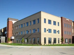 exterior of a three-story white office building - project