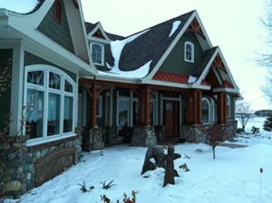 exterior of a residential house covered in snow